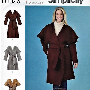 May include: Simplicity sewing pattern R10261, size US 6-14, for a wrap coat with a V-neck, long sleeves, and a tie belt. The pattern includes three variations: A in brown, B in gray, and C in a brown and white plaid.