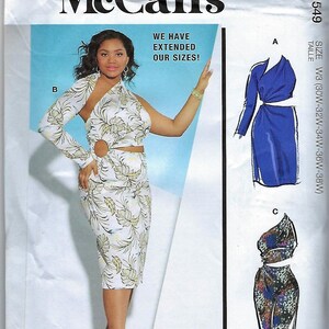 May include: A sewing pattern for a dress with three different style options. The dress is shown in a floral print, a solid blue, and a patterned print. The pattern includes instructions for sizes W3 (30W-32W-34W-36W-38W).