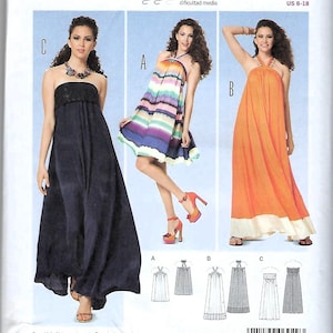 May include: A sewing pattern for a dress with three different styles. The pattern is for sizes EUR 32-44 and US 6-18. The pattern includes seam and hem allowances. The pattern is for a dress with a halter neckline and a gathered skirt.