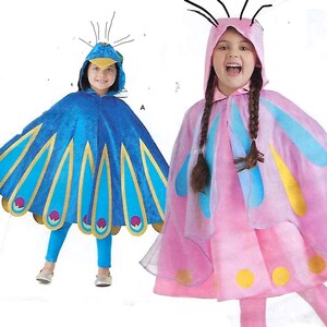 May include: Two children wearing costumes. One is a blue peacock costume with a hood and cape, the other is a pink butterfly costume with a hood and cape. Both costumes have matching leggings.