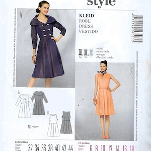May include: A Burda Style sewing pattern featuring two dress designs. The pattern includes sizes 6-18, with illustrations of the finished garments. The cover displays the Burda Style logo and the text "KLEID, ROBE, DRESS, VESTIDO".