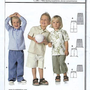 May include: A sewing pattern for children's pants, featuring three children modeling different styles. The pattern includes options for pants, shorts, and capris. The Burda Start 2 pattern includes seam and hem allowances. The pattern number is 9793.