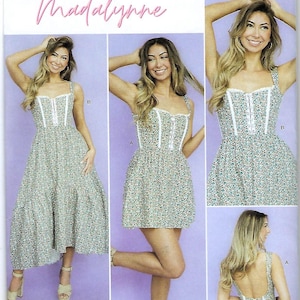 May include: Simplicity sewing pattern S9779 featuring a floral print dress with white trim and a square neckline. The pattern includes options for a long or short dress. The image also includes the text "Madalynne".