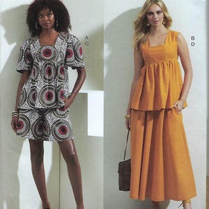 May include: Vogue Patterns V1871. The image shows two different outfits. One is a matching set with a square-neck top and shorts in a white, brown, and red circular pattern. The other is a sleeveless, mustard-colored top and skirt. The pattern is designed and printed in the USA.