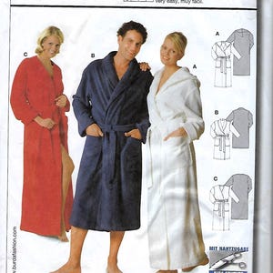 May include: A sewing pattern for a bathrobe with a hood. The pattern includes instructions for making a robe in three different colors: red, blue, and white. The pattern is called "Burda Easy" and the pattern number is 2653.