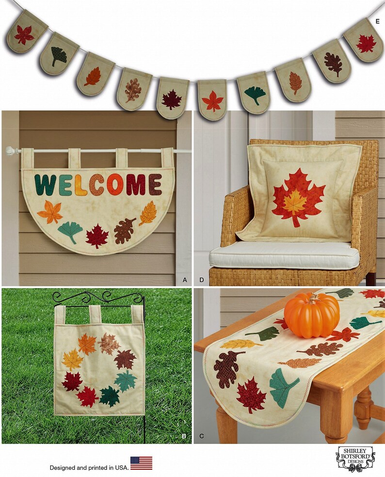 May include: A collection of fabric home decor items featuring autumn leaf motifs in shades of red, orange, brown, and green. The set includes a bunting banner, a semi-circular welcome wall hanging, a square pillow, a garden flag, and a table runner.
