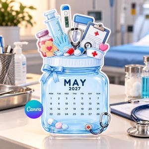 May include: A blue glass jar-shaped calendar for May 2027, decorated with medical illustrations including a syringe, thermometer, stethoscope, clipboard, bandage, pills, and a nurse cap. The calendar displays the month, year, and dates.