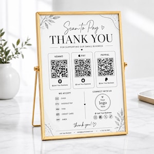Könnte beinhalten: Ein goldgerahmtes Tischschild mit dem Text Scan to Pay THANK YOU FOR SUPPORTING OUR SMALL BUSINESS. Es enthält drei QR-Codes für Venmo, Apple Pay und PayPal sowie Symbole für Bargeld, Google Pay, Visa, Kreditkarte und Amex.