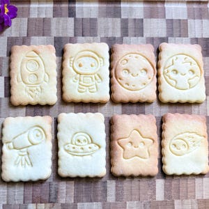 Personalized space-themed cookie cutter, customizable with name and designs, biscuit cutter, gift idea