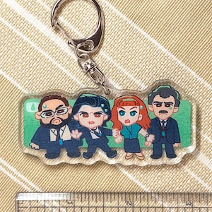 May include: A set of three ceramic nesting bowls in graduating sizes. The bowls feature a speckled, matte finish in shades of cream, light brown, and dark brown. The largest bowl measures approximately 8 inches in diameter.