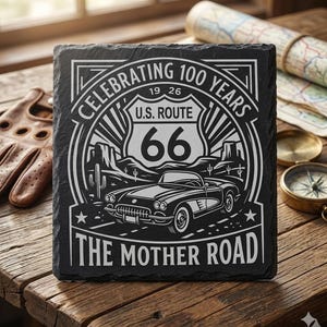 May include: Black slate coaster with a white graphic celebrating 100 years of U.S. Route 66. The design includes a classic car, the iconic Route 66 shield, and the words "The Mother Road."
