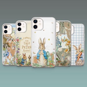 May include: Five clear smartphone cases featuring Peter Rabbit illustrations. Designs include the book title, garden scenes with terracotta pots, watering cans, flowers, and a rabbit holding a carrot against blue gingham or vintage paper backgrounds.