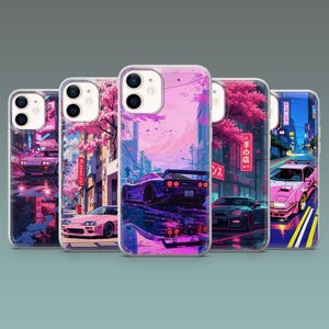 May include: Five phone cases with a vibrant illustration of sports cars in a city setting. The artwork features a pink and purple color scheme, with cherry blossom trees and Japanese text. The cases are designed for a smartphone.