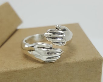 Hug Ring in Sterling Silver, silver hug ring, hugging hands ring, silver hands, silver promise ring, unique silver ring, free hugs jewelry