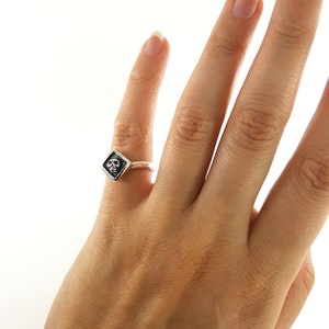 tiny sterling silver skull pinky ring