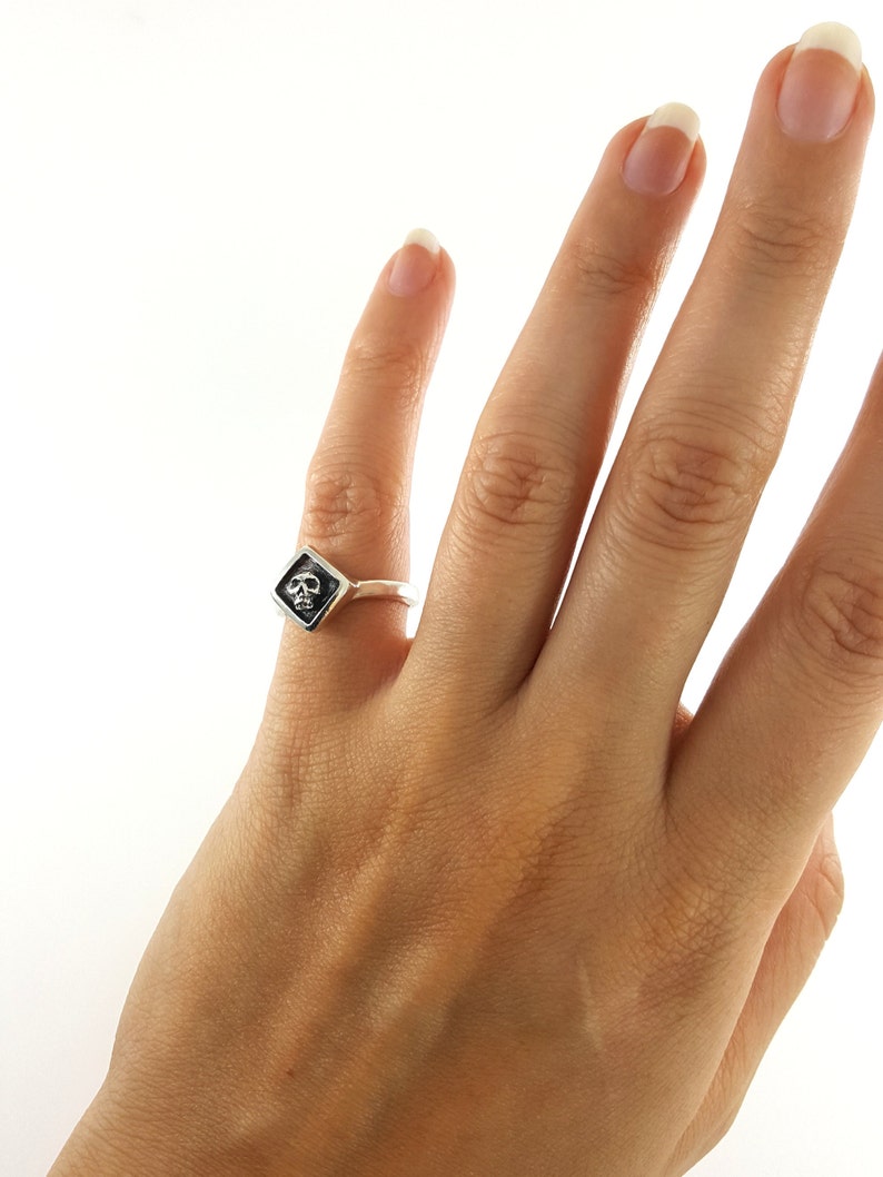tiny sterling silver skull pinky ring