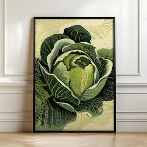 May include: A framed art print featuring a detailed illustration of a cabbage. The artwork showcases varying shades of green, with intricate dot and line work. The cabbage is centered against a light yellow background, framed in black.