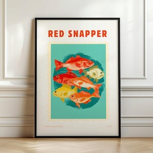 May include: A framed art print featuring a vintage-style illustration of several red snapper fish. The artwork is set against a teal background with the words "RED SNAPPER" in bold orange letters at the top. The print is framed in a black frame.