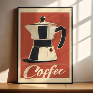 May include: Framed poster with a retro design of a coffee maker in black and cream on a red backdrop. The word "Coffee" is written in a vintage style at the bottom. The poster is in a black frame.