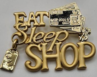 Vintage firmado AJC Vintage Eat Sleep Shop Broche Oro Tono Dangle Charm Broche