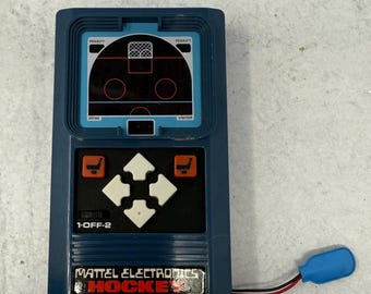 Vintage 1970s Electronic Hockey game handheld red LED digital light and sound mobile mini game Mattel 1978 Tested Working