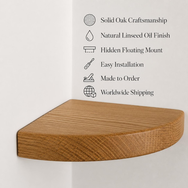 May include: A quarter-circle corner shelf made of solid oak with a natural linseed oil finish. The shelf features a hidden floating mount. Text on the wall lists features: Solid Oak Craftsmanship, Natural Linseed Oil Finish, Hidden Floating Mount, Easy Installation, Made to Order, and Worldwide Shipping.