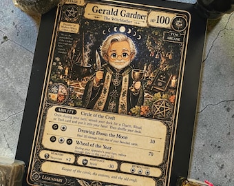May include: A rectangular trading card featuring an illustration of Gerald Gardner, the Witchfather, with 100 HP. The card displays text including Ability: Circle of the Craft, Drawing Down the Moon, and Wheel of the Year, with gold and black ornate borders.