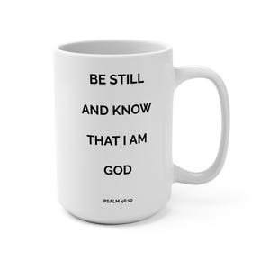 以下が含まれることがあります： 黒い文字で「BE STILL AND KNOW THAT I AM GOD」と印刷され、その下に「PSALM 46:10」と記された白いセラミック製のマグカップ。滑らかな円筒形の本体と右側に湾曲した持ち手が付いており、シンプルで清潔感のあるデザインが特徴です。