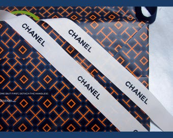 vintage chanel ribbon authentic white and black ribbon 31.00" length 1.00" wide.