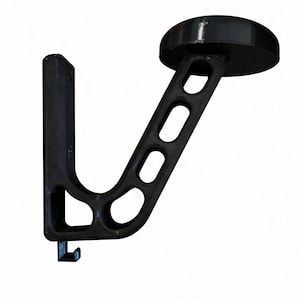 May include: A black metal wall-mounted coat rack with a rounded top and a hook. The rack has a curved arm with three oval cutouts and a vertical support with a small hook at the bottom. The design is simple and functional.