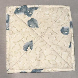 May include: A set of three ceramic mugs with a speckled, matte finish in cream, light grey, and dark grey. Each mug has a simple, minimalist design, suitable for coffee or tea.