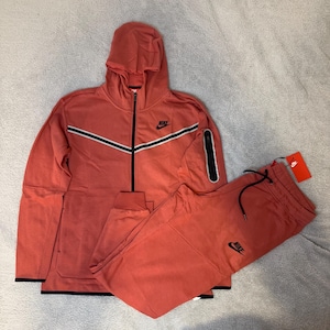 orange nike tech tracksuit