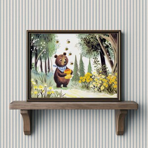 May include: A framed illustration of a brown bear in a forest setting. The bear, wearing a blue and white checkered scarf, holds a yellow honey pot. Several bees fly around the bear. The artwork is set on a wooden shelf against a striped background.
