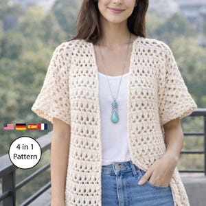 May include: A cream-colored, open-front crochet cardigan with short sleeves. The cardigan is worn over a white top and blue jeans. A silver necklace with a turquoise pendant is visible. The image includes a graphic that says "4 in 1 Pattern".