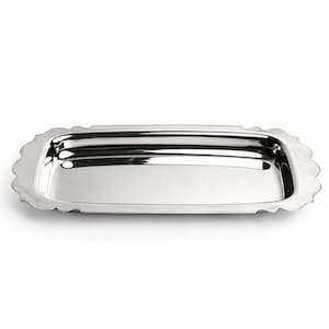 May include: A rectangular silver-toned metal tray with a polished, reflective surface and a scalloped edge design. The tray features a shallow basin with rounded corners and a smooth, continuous border that frames the central flat area.