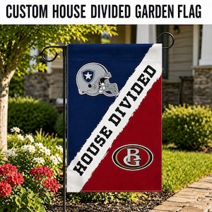 May include: A rectangular garden flag featuring a diagonal split design. The left side is dark blue with a silver football helmet logo. The right side is red with a gold and red oval logo. A white diagonal stripe reads HOUSE DIVIDED in black.