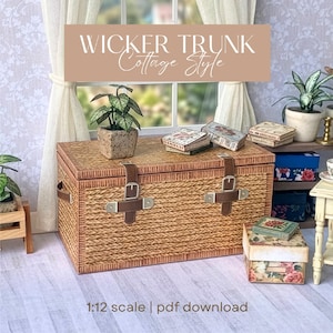 May include: A miniature wicker trunk with leather straps and buckles. The trunk is a light brown color and has a woven texture. The text "Wicker Trunk Cottage Style" is displayed above the trunk. A small potted plant and several miniature boxes are on top of the trunk.