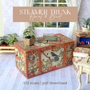May include: Miniature steamer trunk with floral and bird design. The trunk features a brown frame, leather straps, and brass accents. The trunk is decorated with a colorful pattern of flowers, butterflies, and birds. The text "STEAMER TRUNK Floral & Bird" is displayed on the image.