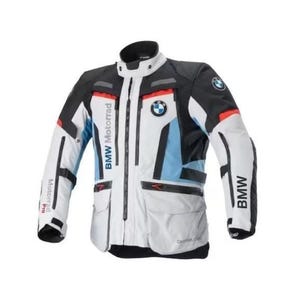 May include: A white, black, and blue BMW Motorrad motorcycle jacket. The jacket has a high collar, multiple pockets, and the BMW logo on the chest and sleeve. The jacket has the words "BMW Motorrad" printed on the front.