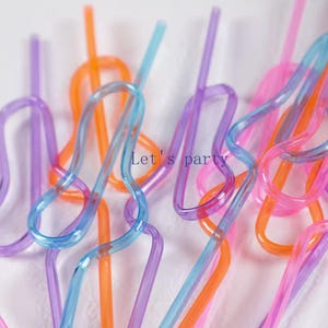 May include: A set of three ceramic mugs with a speckled, matte finish. The mugs are in shades of cream, light gray, and dark gray. Each mug has a simple, minimalist design, perfect for coffee or tea.