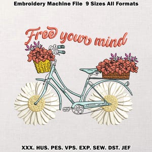 May include: An embroidery design featuring a light blue bicycle with daisy wheels and flower baskets. The text "Free your mind" is in orange script. The design includes the file formats: XXX, HUS, PES, VPS, EXP, SEW, DST, and JEF.