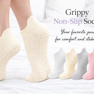 May include: Ankle socks with textured grip dots on the soles, shown in cream, white, grey, pink, and black. The text reads: Grippy Non-Slip Socks. Your favourite pair for comfort and stability.