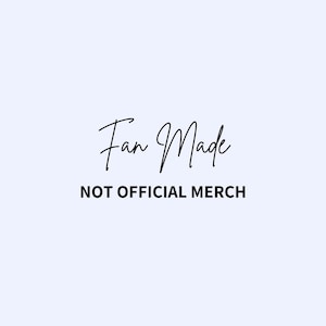 May include: A light blue background with the words "Fan Made" in a cursive font above the text "NOT OFFICIAL MERCH" in a sans-serif font. The text is black.