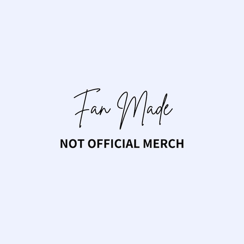 May include: A light blue background with the words "Fan Made" in a cursive font above the text "NOT OFFICIAL MERCH" in a sans-serif font. The text is black.