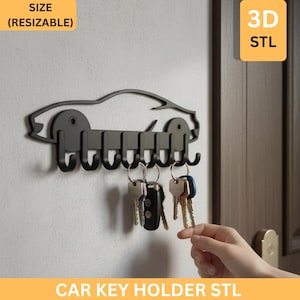 Könnte beinhalten: Schwarzer metallener Autoschlüsselhalter mit sieben Haken, montiert an einer weißen Wand. Der Schlüsselhalter trägt unten den Text "CAR KEY HOLDER STL" und in den oberen Ecken "SIZE (RESIZABLE)" und "3D STL".