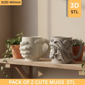 May include: Two off-white ceramic mugs. One mug features a hand-shaped handle, and the other has an octopus tentacle design. The mugs are displayed on a wooden shelf with plants in terracotta pots. Text on the image reads "PACK OF 2 CUTE MUGS STL" and "SIZE=60mm".