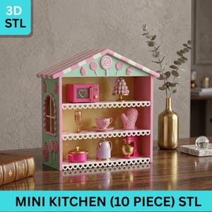 May include: A miniature pink and green kitchen set with a house-shaped shelf. The set includes a microwave, mixer, teapot, and other kitchen accessories. The text "MINI KITCHEN (10 PIECE) STL" is displayed at the bottom.