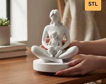 May include: A white Mother's Day statue featuring a mother figure seated in a meditative pose, cradling a smaller child. The statue is 70mm in size and is a 3D STL design. The base is round and the statue is held by hands.