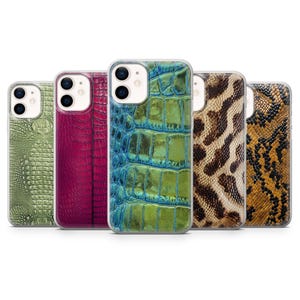 May include: Five smartphone cases with textured faux-leather finishes. The cases display a range of colours and patterns, including green, magenta, blue-green, brown, and yellow-brown. The cases are designed to fit a smartphone.