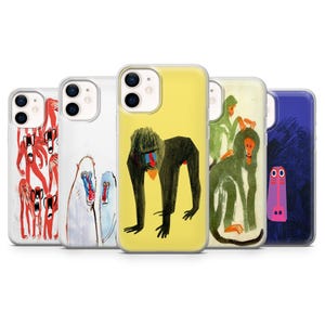 May include: A collection of five phone cases featuring colorful, artistic illustrations. The designs include a red creature, a white and blue primate, a black primate with a yellow background, a green primate, and a purple figure on a blue background.